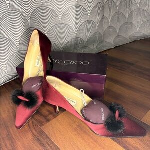 Jimmy Choo Burgundy Satin Pointed Toe Pumps with Black Pom Trim